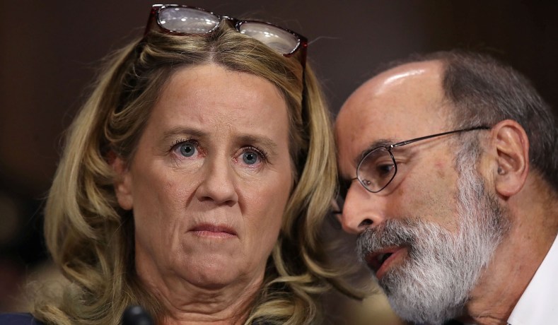 Christine Blasey Ford listens to her attorney Michael Bromwich while testifying the Senate Judiciary Committee with in the Dirksen Senate Office Building on Capitol Hill in Washington